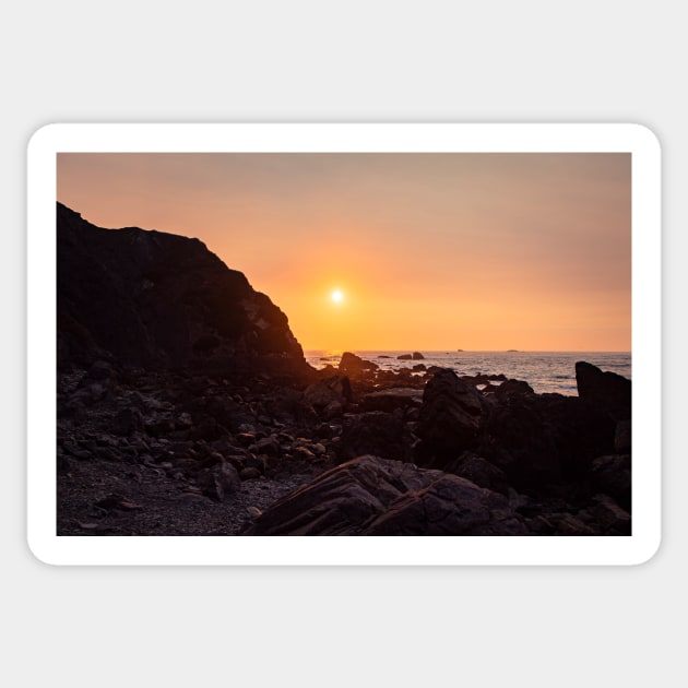 Orange Sunset Over A Rocky Beach Sticker by blossomcophoto